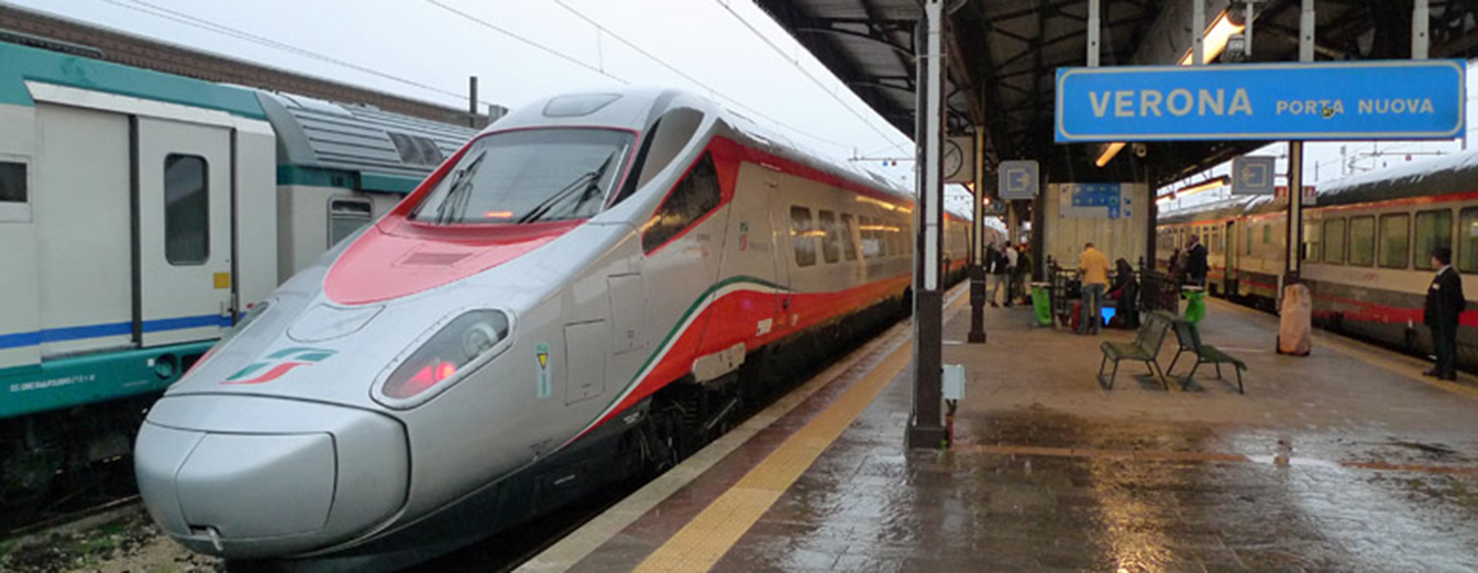 a train waits for passengers at Verona's Porta Nuova station