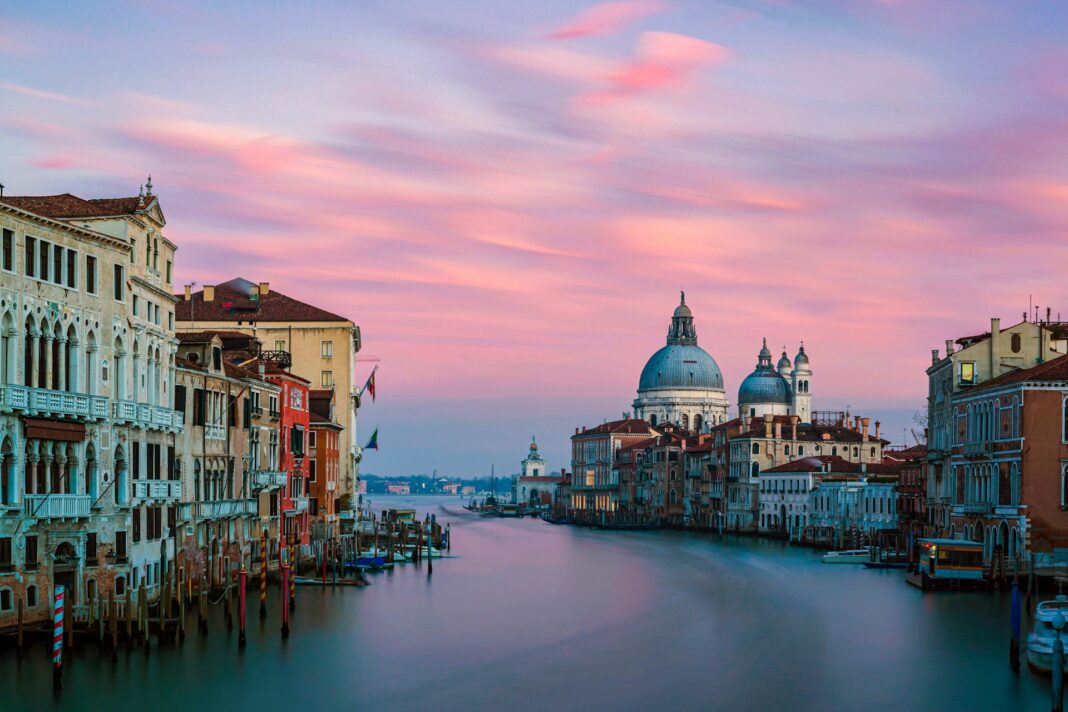 a long exposure photograph of Venice, Italy at sunset