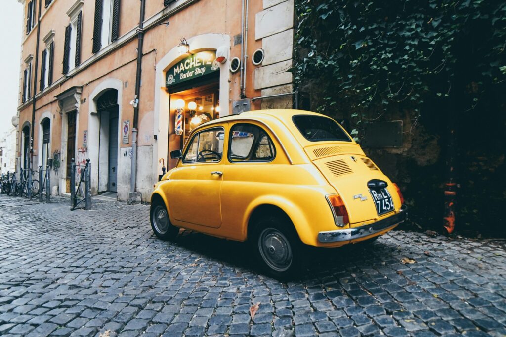a car is parked on a street in Italy