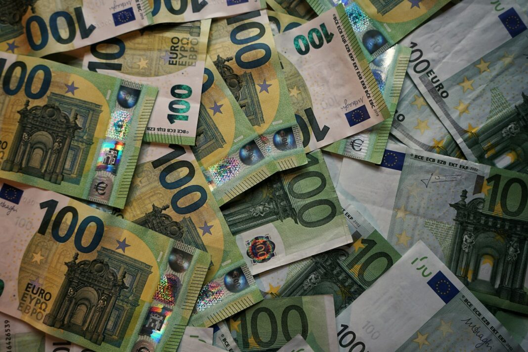 a pile of euro notes representing taxes